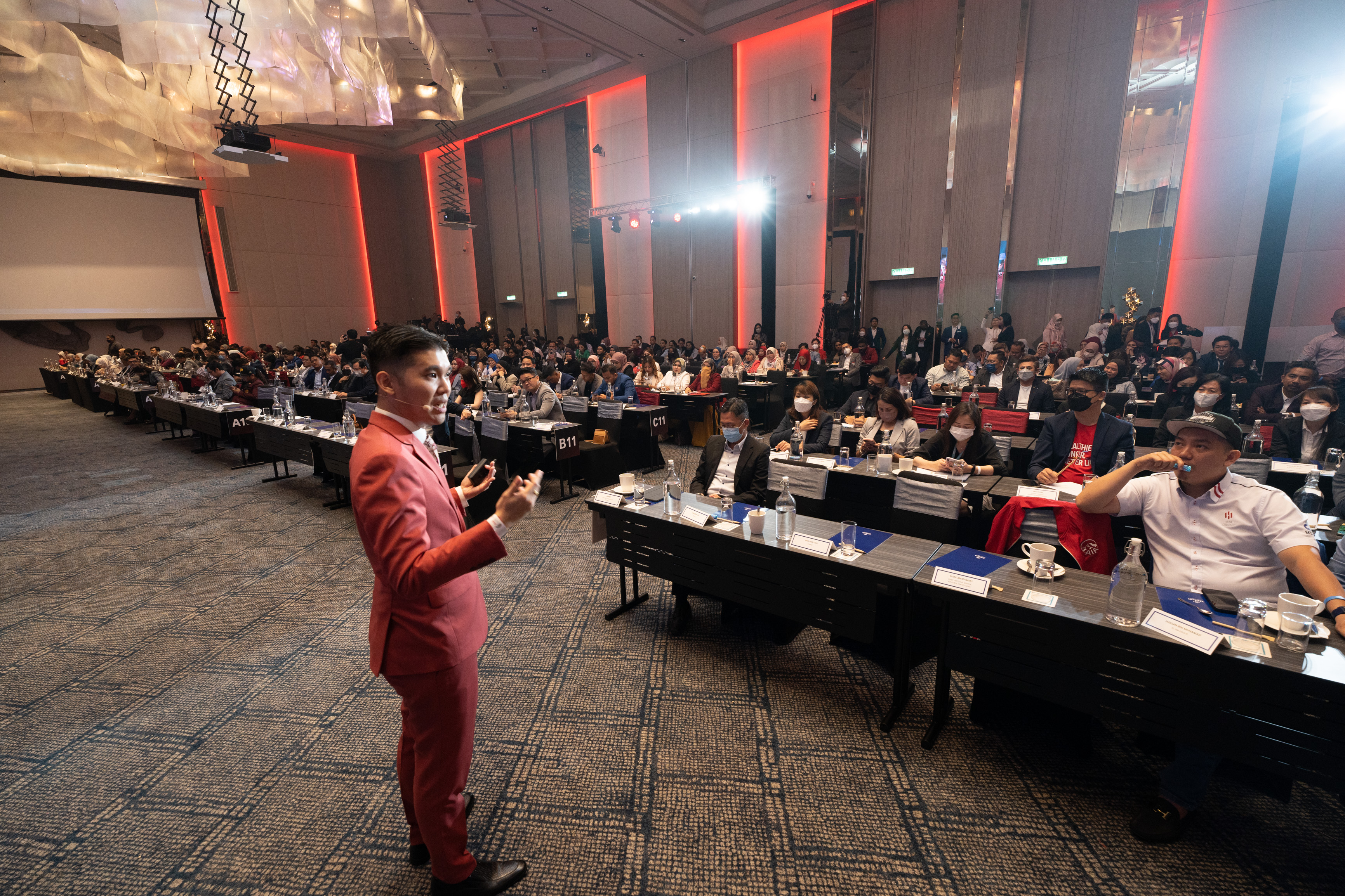 Michael Teoh speaking at AIA Elite Conference 2022
